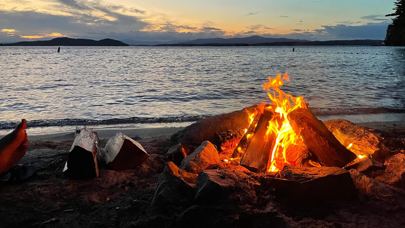 Bonfire at sunset on Lake Winnipesaukee